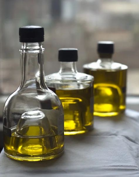 Three bottles of olive oil Royalty Free Stock Photos