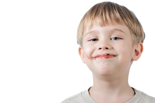 Boy with chocolate on the face isolated — Stock Photo, Image