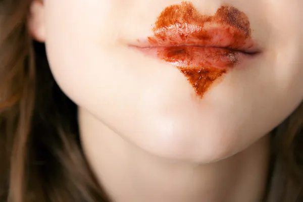 Csokoládé szív ajkán Stock Kép