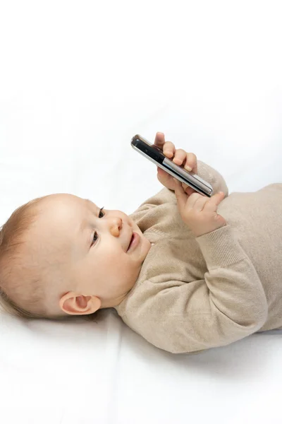 Liten pojke med mobiltelefon — Stockfoto