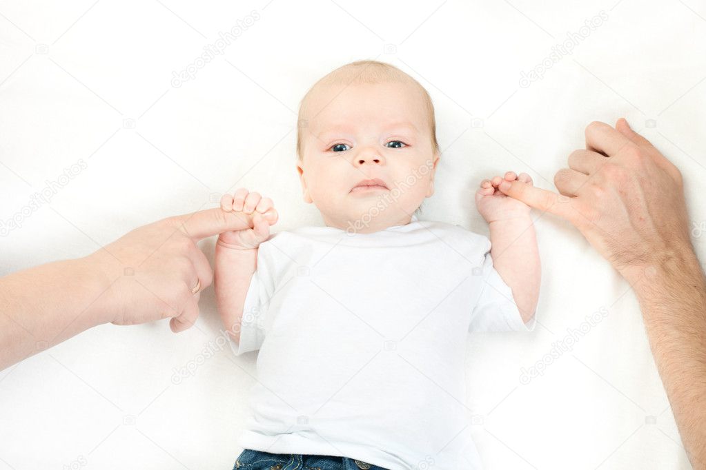 Happy family - baby on the bed