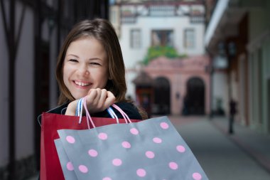 Young woman with shopping bags clipart