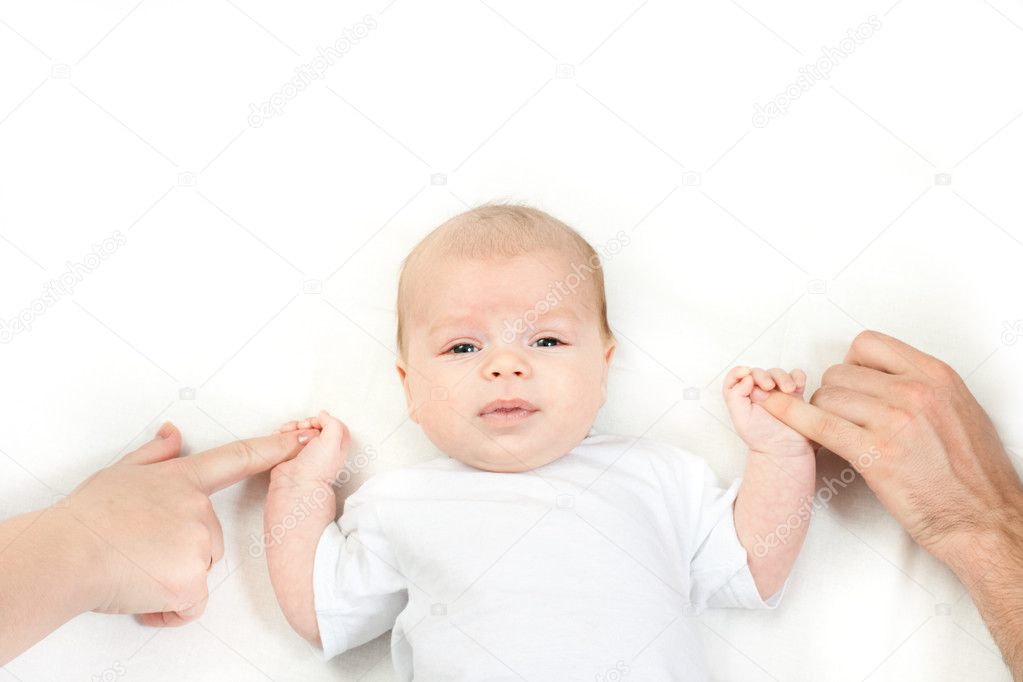 Happy family - baby on the bed