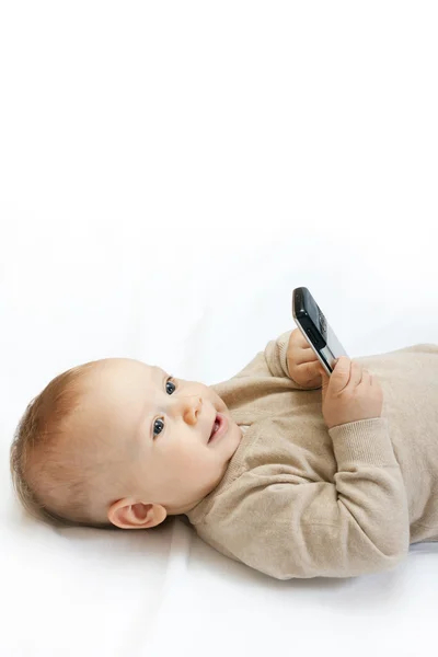Malý chlapec s mobilním telefonem — Stock fotografie