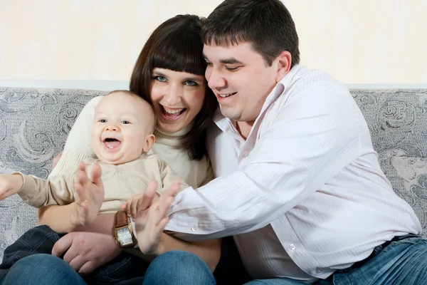 Happy family - father, mother and baby — Zdjęcie stockowe