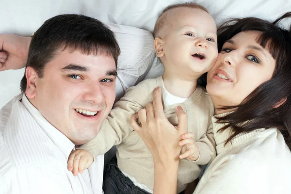 Happy family - father, mother and baby — Zdjęcie stockowe
