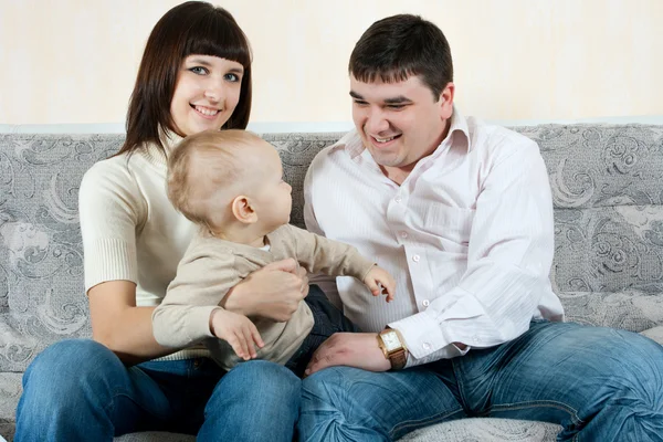 Happy family - father, mother and baby — Stock Photo, Image