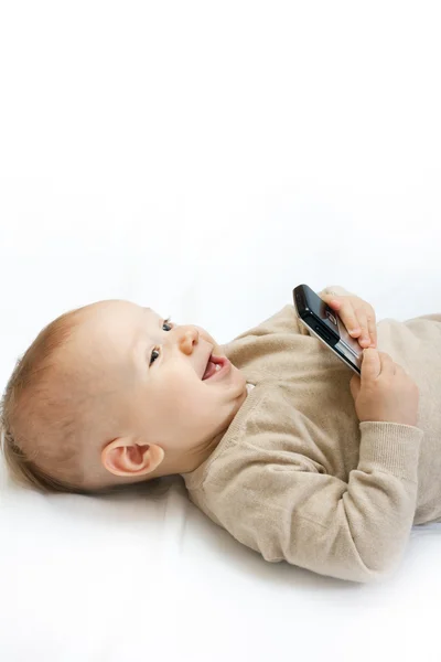 Mały chłopiec z telefonem komórkowym — Zdjęcie stockowe
