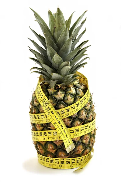 Pineapple with measuring tape. — Stock Photo, Image