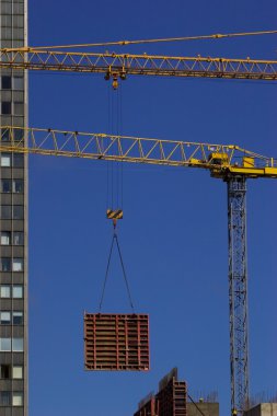 Construction crane lifting clipart