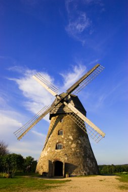 Traditional dutch windmill in Latvia clipart