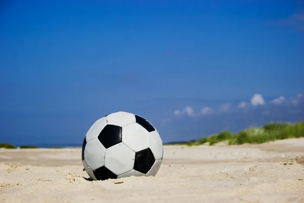 stock image Soccer ball on sandy beach
