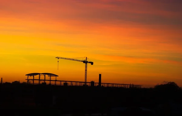 Tower crane in sunset — Stock Photo, Image
