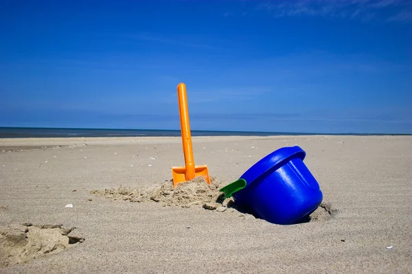 Beach spade and bucket Stock Photo