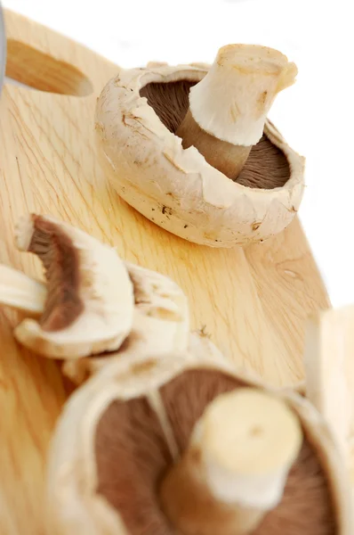 Champignons on wooden board — Stock Photo, Image