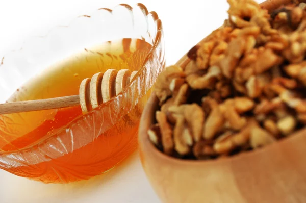 Dish with honey and wallnuts — Stock Photo, Image