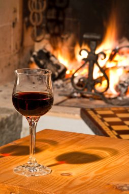 Red wine and fireplace clipart