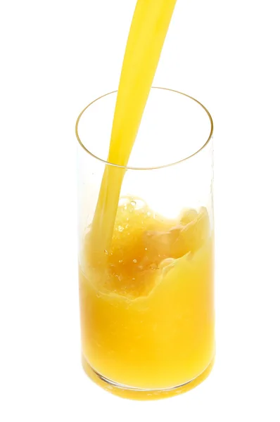 Pooring orange juicefruits — Stockfoto