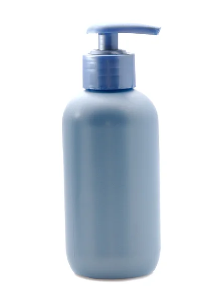 Синяя косметическая бутылка — стоковое фото