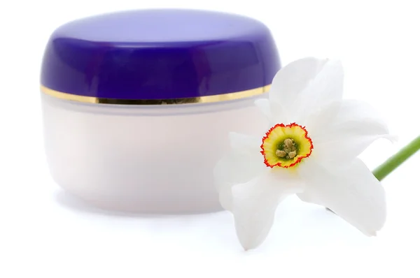 Cosmetic cream with flowers — Stock Photo, Image