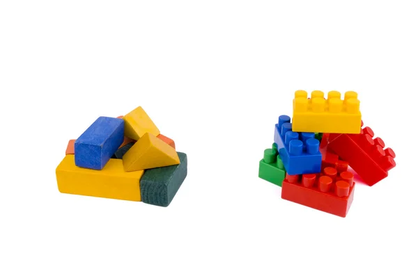Wooden or plastic bricks? — Stock Photo, Image