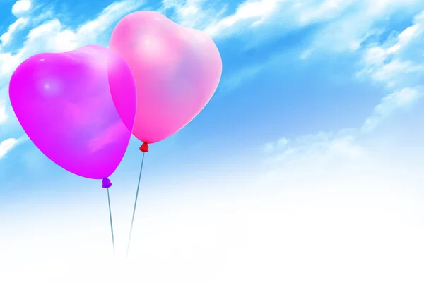 Gekleurde ballonnen in blauwe hemel — Stockfoto