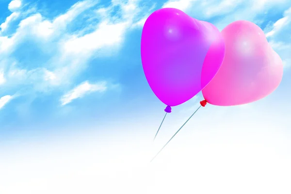 Färgade ballonger inon blå himmel — Stockfoto