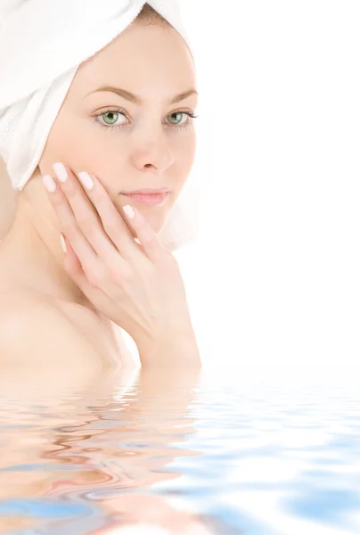 Woman in white towel Stock Picture