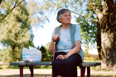 Old Laydy on a bench, clipart