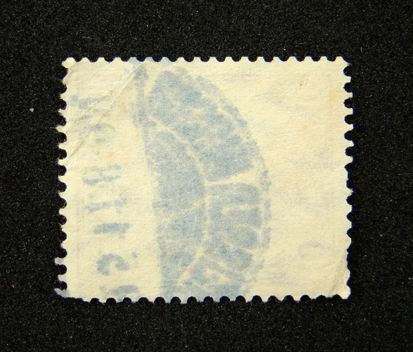 Blank postage stamp with postmark — Stock Photo, Image