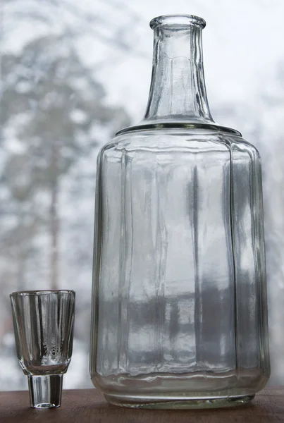 Decanter in the window — Stock Photo, Image