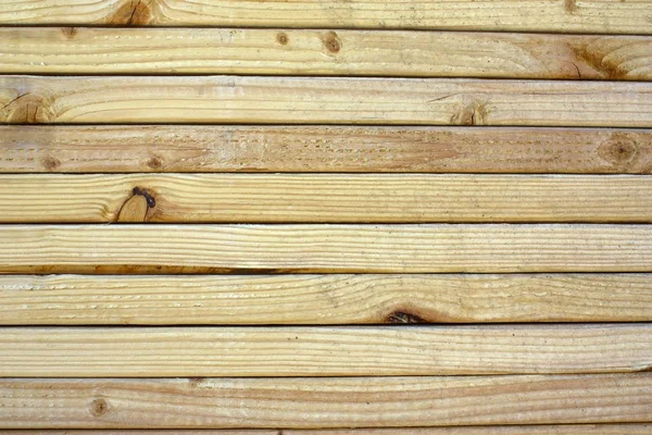 Primer plano de grano sobre madera apilada . — Foto de Stock