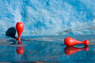 Bowling in an empty swimming pool clipart