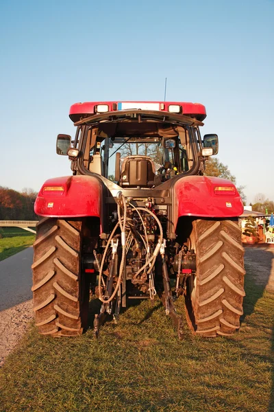 Modern red farm tractor — Stok fotoğraf