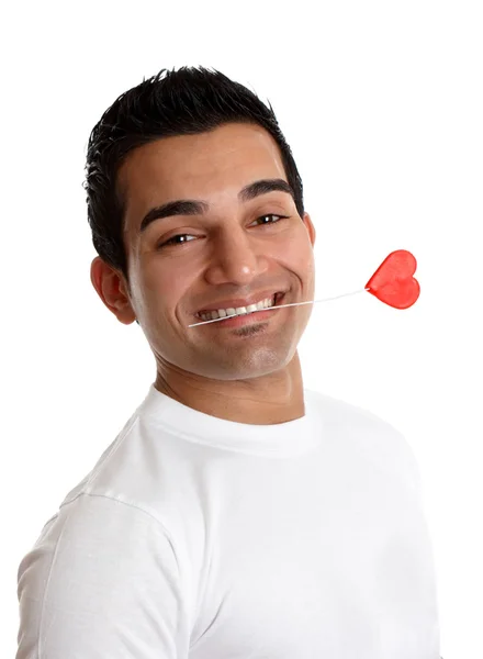 Flirtatious uomo holding un amore cuore — Foto Stock