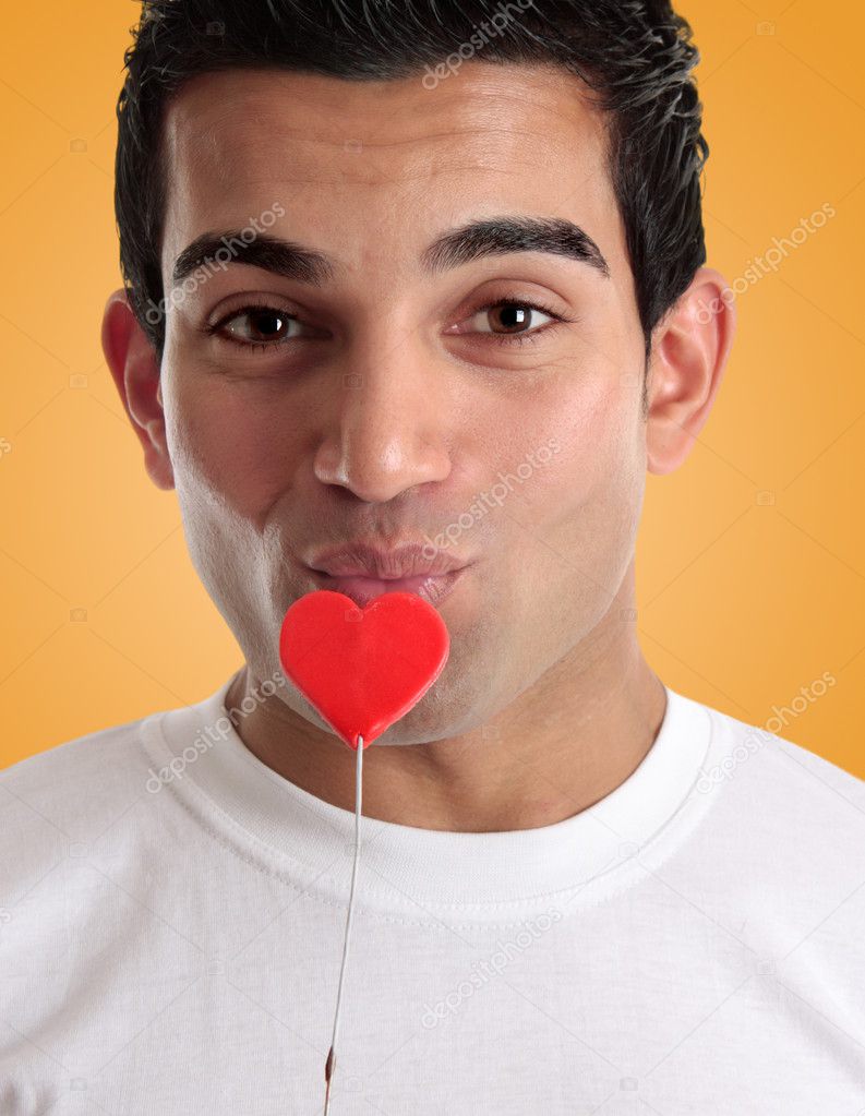 Amorous man kissing love heart