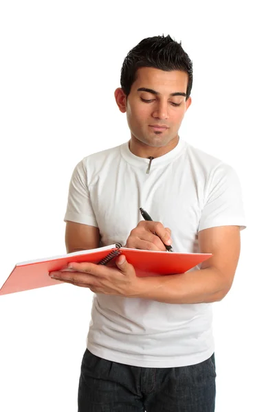 Человек или студент пишет в блокноте — стоковое фото