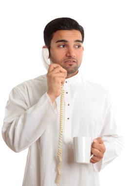 Business dilemma - worried man on phone clipart