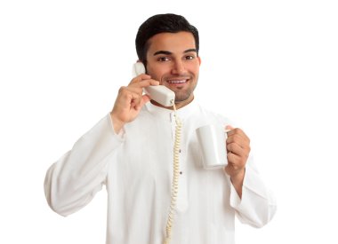 Friendly ethnic businessman on phone clipart