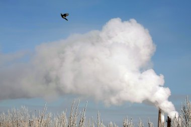 Refinery with smoke stacks clipart