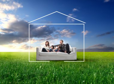 family sitting on a sofa on meadow clipart