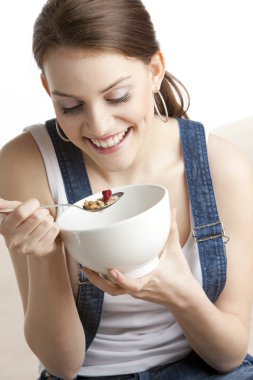 Woman eating cereals clipart