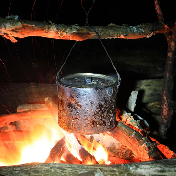 Kettle on hot fire — Stock Photo, Image