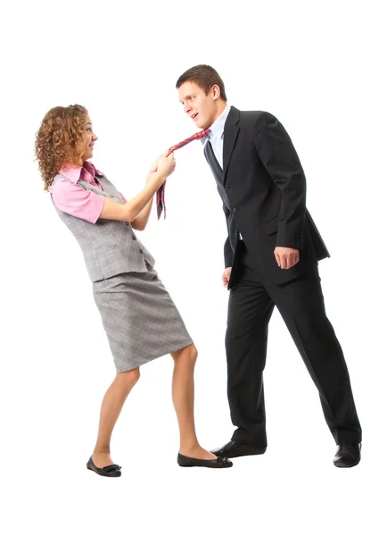 Девушка тянет мужчину в галстуке — стоковое фото