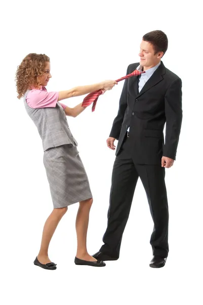 Girl pulls a man in a tie — Stock Photo, Image