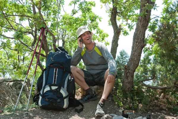 stock image Happy hiker calling home