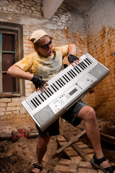 Musician plays a synthesizer — Stock Photo, Image