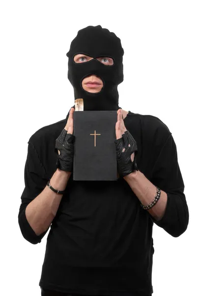 Ladrão arrependido com a Bíblia — Fotografia de Stock