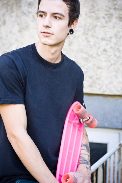 Oldschool skater holding this board — Stock Photo, Image