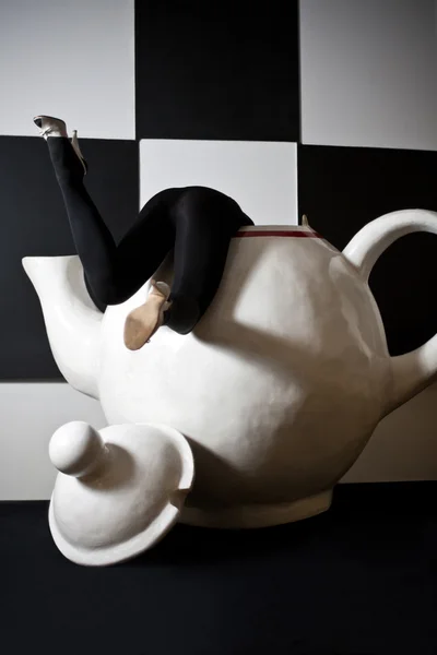 Woman trapped in a huge tea pot — Stock Photo, Image